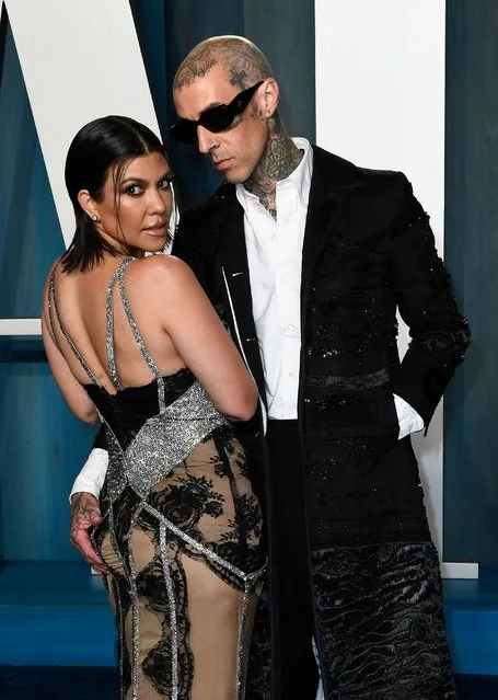 US musician Travis Barker and Kourtney Kardashian attend the 2022 Vanity Fair Oscar Party following the 94th Oscars at the The Wallis Annenberg Center for the Performing Arts in Beverly Hills, California on March 27, 2022. (Photo by Patrick T. Fallon/AFP Photo)