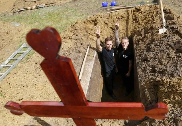 Gravediggers pose after the first Hungarian grave digging championship in Debrecen, Hungary, June 3, 2016, competing for the national crown, which is awarded based on accuracy, speed, and aesthetic quality. (Photo by Laszlo Balogh/Reuters)
