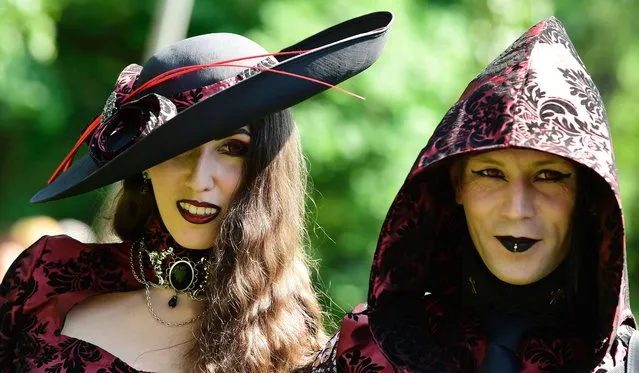 Dressed up people attend a so-called “Victorian Picnic” during the Wave-Gotik-Treffen (WGT) festival in Leipzig, eastern Germany, on June 2, 2017. (Photo by Tobias Schwarz/AFP Photo)