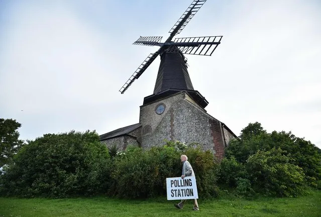 President of the Friends of West Blatchington Windmill Peter Hill prepares to open a Polling Station at the Windmill near Brighton, in southern England on June 8, 2017, as Britain holds a general election. As polling stations across Britain open on Thursday, opinion polls show the outcome of the general election could be a lot tighter than had been predicted when Prime Minister Theresa May announced the vote six weeks ago. (Photo by Glyn Kirk/AFP Photo)