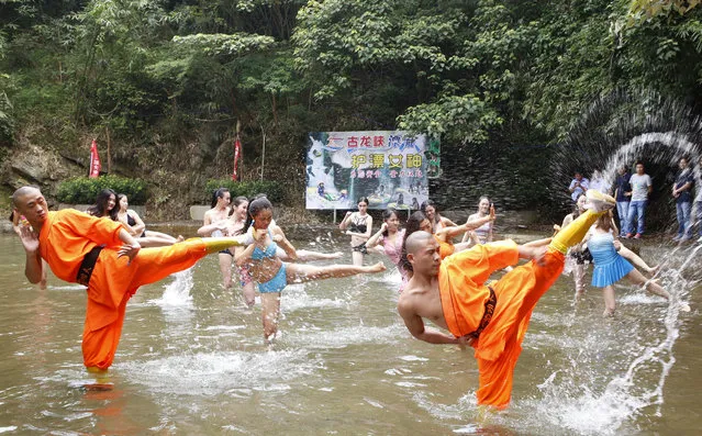 Candidates for a drifting support team practise kong fu with shaolin monks at a camp in Qingyuan, Guangdong Province, China, June 17, 2016. (Photo by Reuters/Stringer)