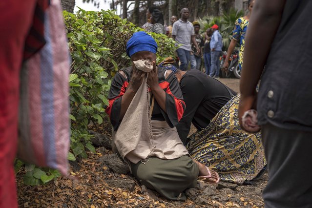 Women grieve at the port of Goma, Democratic Republic of Congo, after a ferry carrying hundreds capsized on arrival Thursday, October 3, 2024. (Photo by Moses Sawasawa/AP Photo)