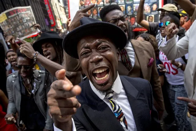 Protesters take part in “Artists Take Fight Against Police Murders” in New York's Times Square August 13, 2015. (Photo by Brendan McDermid/Reuters)