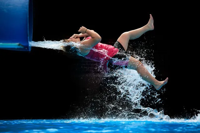 People sliding down a water slide. (Photo by Krista Long)