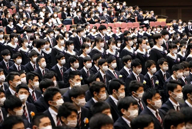 Students wearing masks attend the graduation ceremony at Fukuoka Joto High School on March 1, 2020 in Fukuoka, Japan. (Photo by The Asahi Shimbun via Getty Images)