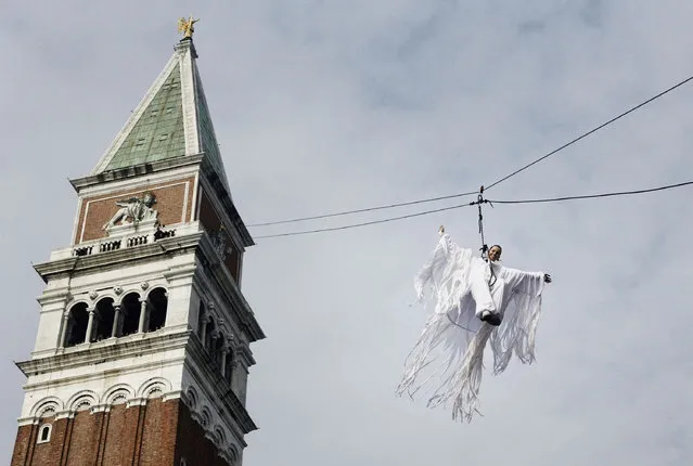 Italian athlete Federica Pellegrini descends the St.Mark's bell tower during the flight of the angel, as a traditional opening ceremony for the beginning of the Carnival, on February 11, 2007 in Venice, Italy. (Photo by Marco Di Lauro)