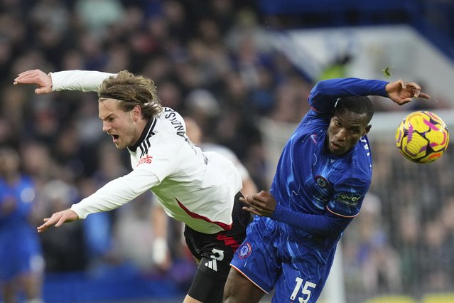 Fulham's Joachim Andersen, left, fights for the ball with Chelsea's Nicolas Jackson during the English Premier League soccer match between Chelsea and Fulham at Stamford Bridge stadium in London, Thursday, December 26, 2024. (Photo by Kirsty Wigglesworth/AP Photo)