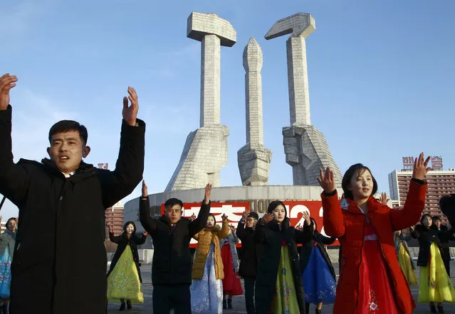 Locals participate in a public dance on the 28th anniversary of the start of Chairman Kim Jong Il's leadership of the Korean People's Army at the Monument to Party Founding in Pyongyang, North Korea, Tuesday, December 24, 2019. (Photo by Jon Chol Jin/AP Photo)