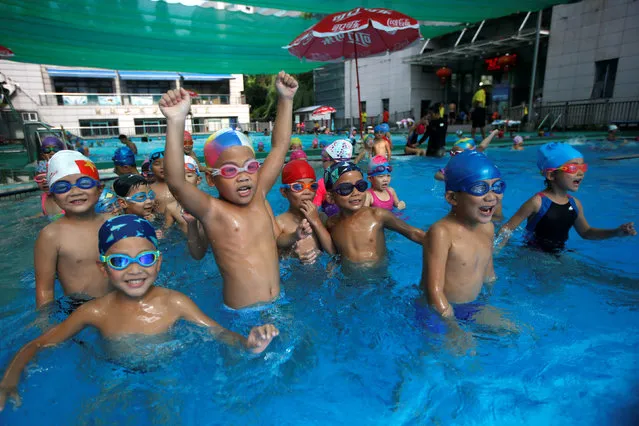Children attend a swim training session at Hangzhou Chen Jinglun Sport school Natatorium, where Chinese Olympic swimmer Sun Yang and Fu Yuanhui also trained, in Hangzhou, Zhejiang province, China, August 10, 2016. (Photo by Aly Song/Reuters)