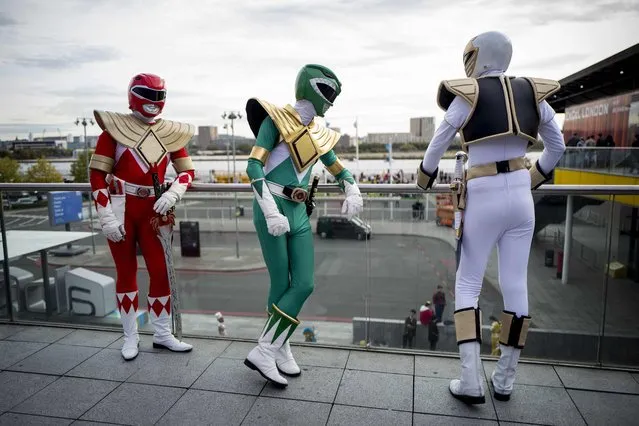 Cosplayers dressed as Power Rangers attend the MCM Comic Con at ExCeL exhibition centre in London on October 28, 2017. (Photo by Tolga Akmen/AFP Photo)