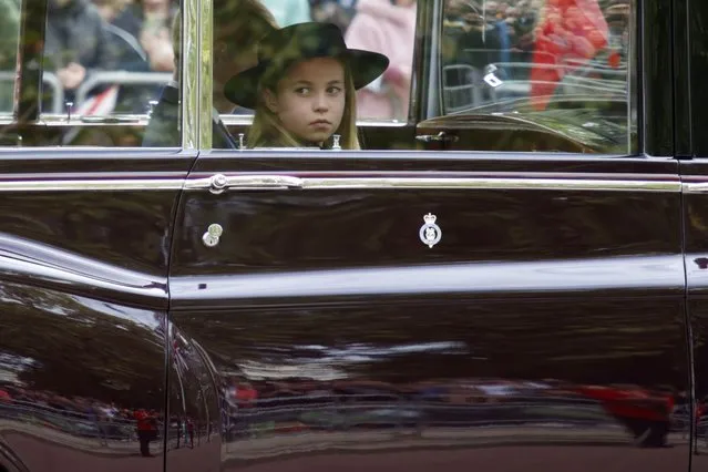 Princess Charlotte sits in a car during the State Funeral Service of Britain's Queen Elizabeth II on the Mall in central London Monday, September 19, 2022. The Queen, who died aged 96 on Sept. 8, will be buried at Windsor alongside her late husband, Prince Philip, who died last year. (Photo by David Cliff/Pool via AP Photo)