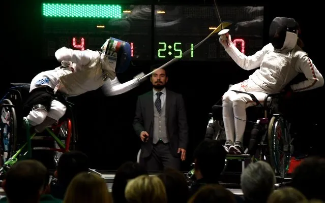 Italian Paralympic Champion Beatrice “Bebe” Vio (L) competes against US athlete Ellen Geddes during the Wheelchair Fencing World Championship in Rome on November 8, 2017. Paralympic fencer Beatrice Vio is a veritable sports icon in Italy, a model of courage whose battle against disease, infectious enthusiasm and prowess have won her legions of loyal fans. (Photo by Tiziana Fabi/AFP Photo)
