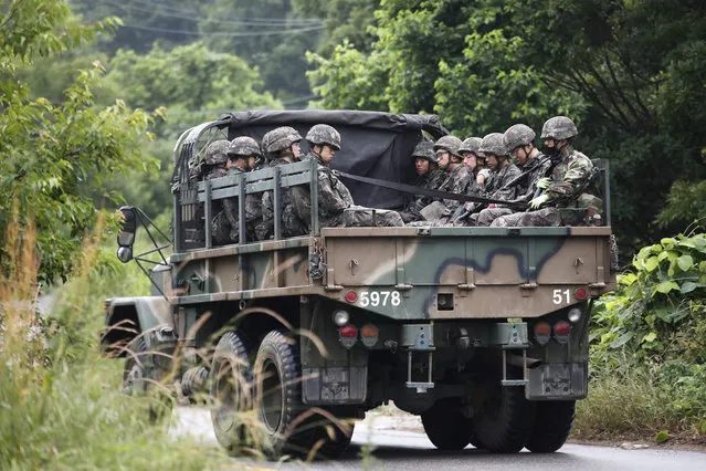 South Korean army soldiers ride on the back of a truck in Paju, South Korea, near the border with North Korea, Friday, June 19, 2020. South Korea said Thursday it hasn't detected any suspicious activities by North Korea, a day after it threatened with provocative acts at the border in violation of a 2018 agreement to reduce tensions. (Photo by Ahn Young-joon/AP Photo)