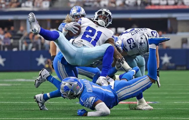 Dallas Cowboys running back Ezekiel Elliott is tackled by Detroit Lions cornerback Jeff Okudah during the game at AT&T Stadium in Arlington, Texas on October 23, 2022. (Photo by Kevin Jairaj/USA TODAY Sports)