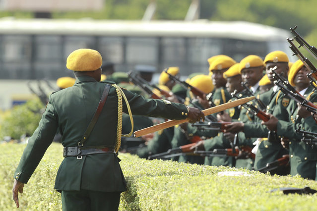 Soldiers make their final drills at the presidential inauguration ceremony of Emmerson Mnangagwa in Harare, Zimbabwe, Friday, November 24, 2017. Mnangagwa will be sworn in as Zimbabwe's president after Robert Mugabe resigned on Tuesday, ending his 37 year rule. (Photo by Tsvangirayi Mukwazhi/AP Photo)