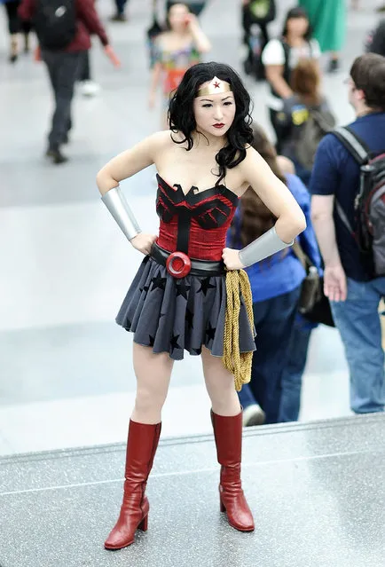A Comic Con attendee poses as Wonder Woman during the 2014 New York Comic Con at Jacob Javitz Center on October 9, 2014 in New York City. (Photo by Daniel Zuchnik/Getty Images)