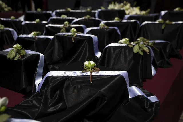 Urns with the ashes of 105 Mexican that died from COVID-19 complications are displayed during a ceremony to mourn their deaths, in Puebla, Mexico, Monday, July 13, 2020. (Photo by Fernando Llano/AP Photo)