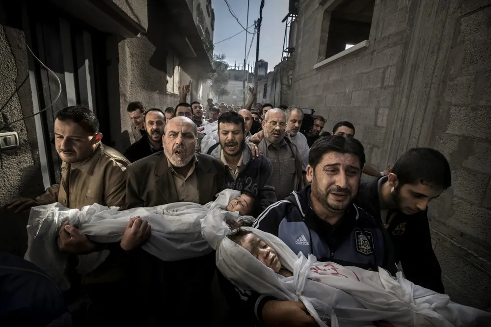 Picture of Palestinian Funeral March Wins World Press Photo 2013 Top Prize