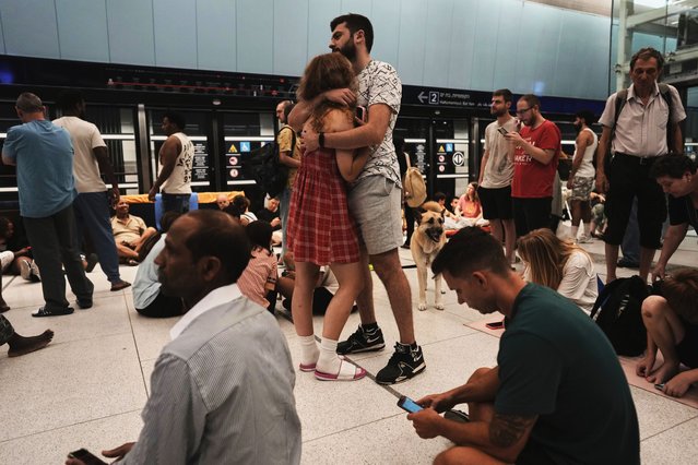 People shelter in an underground metro station as air raid sirens warn of incoming strikes by Iran, in Ramat Gan, near Tel Aviv, Israel, Wednesday, June 18, 2025. (Photo by Oded Balilty/AP Photo)