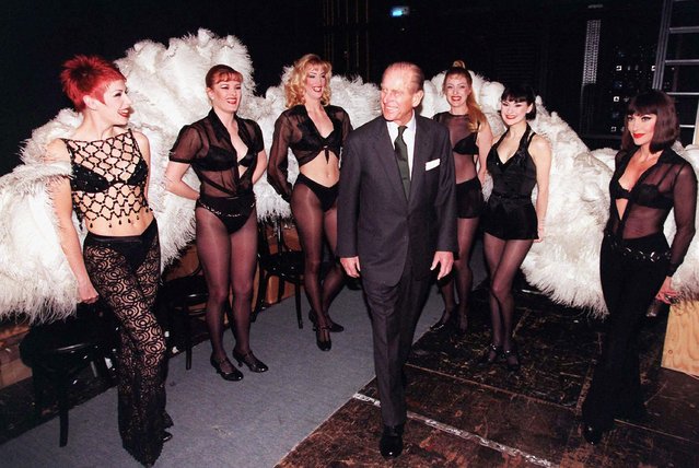 Prince Philip, the Duke of Edinburgh meets members of the cast of “Chicago” during a visit to the Adelphi Theatre in this March 4, 1999 file photo in London, England. (Photo by Anwar Hussein/Getty Images)