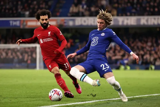 Conor Gallagher of Chelsea battles for possession with Mohamed Salah of Liverpool during the Premier League match between Chelsea FC and Liverpool FC at Stamford Bridge on April 04, 2023 in London, England. (Photo by Ryan Pierse/Getty Images)