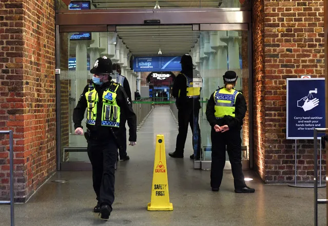 Police at the entrance of the Eurostar terminal at Kings Cross St.Pancras train station in London, Britain, 21 December 2020. France has become the latest country to ban air and rail travel from the UK following news of the new variant Covid-19 that has spread rapidly across London and south-east England. Most of the countries in the EU have suspended flights to and from the UK in the light of this mutated coronavirus strain. (Photo by Facundo Arrizabalaga/EPA/EFE)