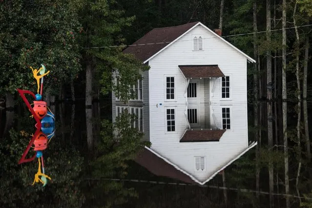 A building is inundated with floodwaters, October 10, 2016, in Lumberton, North Carolina. (Photo by Sean Rayford/Getty Images)