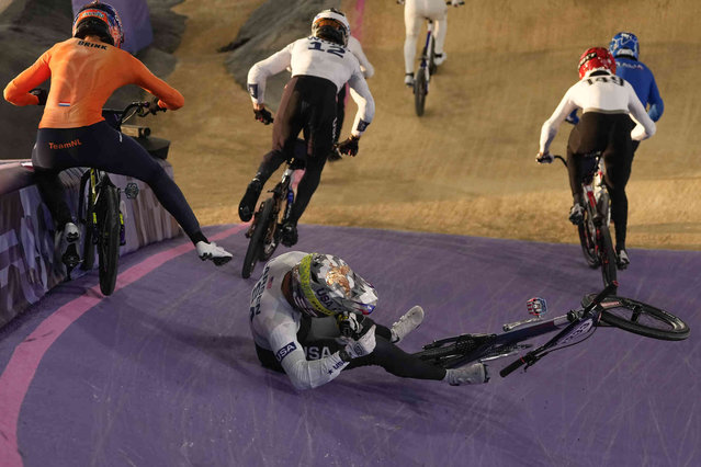 Kamren Larsen of the United States crashes during a BMX racing event, at the 2024 Summer Olympics, Friday, August 2, 2024, in Saint-Quentin-en-Yvelines, France. (Photo by Ricardo Mazalan/AP Photo)
