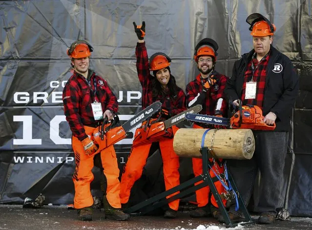 Members of the Ottawa Redblack's "Chainsaw Squad," pose on the sidelines prior to the the CFL's 103rd Grey Cup championship football game between the Redblacks and the Edmonton Eskimos in Winnipeg, Manitoba, November 29, 2015. (Photo by Mark Blinch/Reuters)