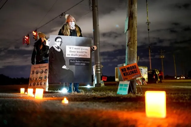 An anti-death penalty activist holds a sign during a vigil outside the United States Penitentiary in Terre Haute, Indiana, U.S. January 15, 2021. (Photo by Bryan Woolston/Reuters)