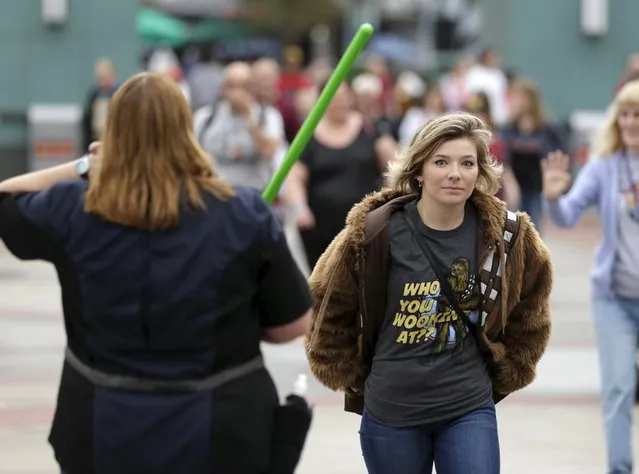 Guests make their way into the Star Wars Launch Bay grand opening at Disney's Hollywood Studios in Orlando, Florida December 4, 2015. (Photo by Scott Audette/Reuters)