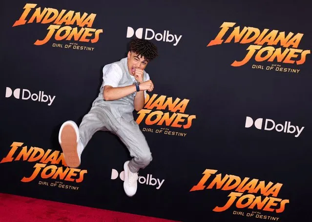 Cast member Ethann Isidore jumps as he attends the U.S. Premiere of Lucasfilm's “Indiana Jones and the Dial of Destiny” in Hollywood, Los Angeles, California, U.S., June 14, 2023. (Photo by Mike Blake/Reuters)