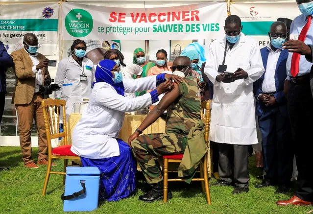 General Mame Thierno Dieng, Senegalese Army physician, receives a dose of the coronavirus disease (COVID-19) vaccine in Dakar, Senegal on February 23, 2021. (Photo by Zohra Bensemra/Reuters)