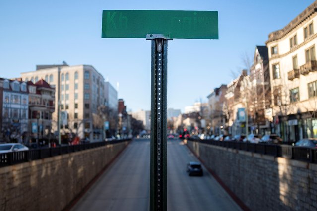 A symbolic street sign named “Khashoggi Way” stands above Connecticut Avenue in the Dupont Circle neighborhood of Washington, U.S., March 2, 2021. (Photo by Tom Brenner/Reuters)