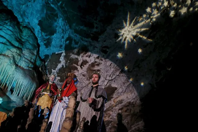 Actors perform the living Nativity biblical scenes in Postojna cave in Postojna, Slovenia, December 22, 2015. (Photo by Srdjan Zivulovic/Reuters)