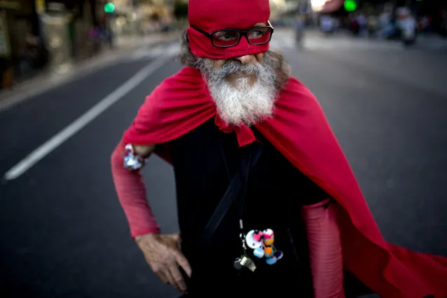 Esteban Florentin, 72, who says he is dressed as an ant, poses for a portrait during a march for justice and against impunity in the case of the mysterious death of late prosecutor Alberto Nisman, in Buenos Aires, Argentina, Wednesday, February 4, 2015. Investigators examining the death of Nisman, who accused Argentine President Cristina Fernandez of agreeing to shield the alleged masterminds of a 1994 terror bombing, said Tuesday, they have found a draft document he wrote requesting her arrest. (Photo by Rodrigo Abd/AP Photo)