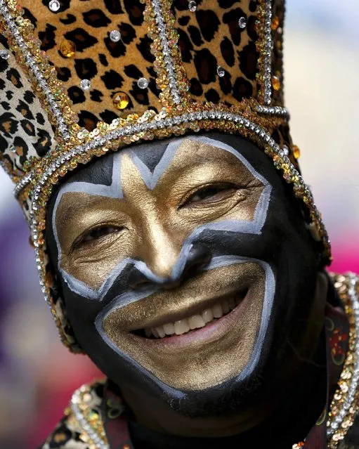 A member of the Zulu Social Aid and Pleasure Club parades down St. Charles Avenue on Mardi Gras in New Orleans, Louisiana February 17, 2015. (Photo by Jonathan Bachman/Reuters)