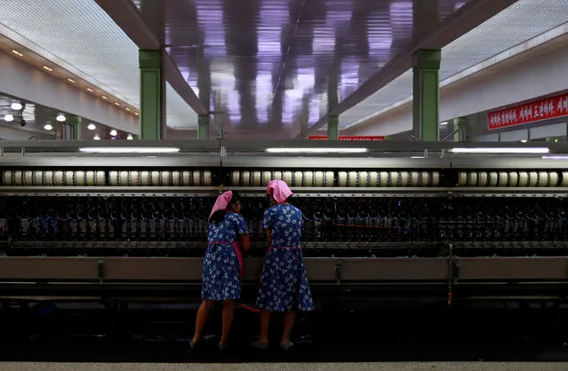 An employee works at a silk factory during a government organised visit for foreign reporters ahead of 70th anniversary of North Korea's foundation in Pyongyang, North Korea on September 7, 2018. (Photo by Danish Siddiqui/Reuters)