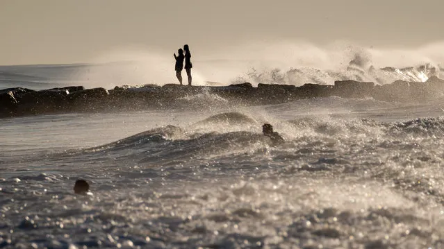 Surfers and others spend a day at Rockaway Beach as impact from Hurricane Lee delvers large surf and rip tides to much of the Northeast on September 14, 2023 in New York City. Hurricane Lee is predicted to make landfall from Nova Scotia to New Brunswick and also parts Maine this weekend. (Photo by Spencer Platt/Getty Images)