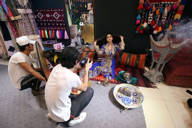 An Iraqi fashion model is seen during a photo session at a fashion centre in Basra, Iraq on July 2, 2018. (Photo by Essam al-Sudani/Reuters)