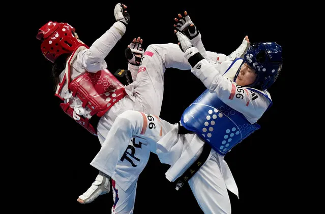 South Korea's Hyejin Park in action with Taiwan's Wei Chun Lin during the Women's 53Kg Gold Medal Contest at the Asian Games in Hangzhou, China on September 26, 2023. (Photo by Tingshu Wang/Reuters)