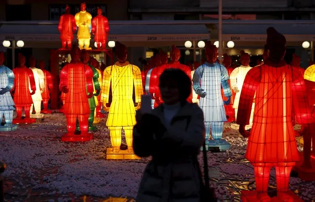A woman takes a selfie next to 80 life-size models of the Terracotta Army during a celebration for the upcoming Chinese New Year at Zagreb's main square, Croatia, January 30, 2016. (Photo by Antonio Bronic/Reuters)