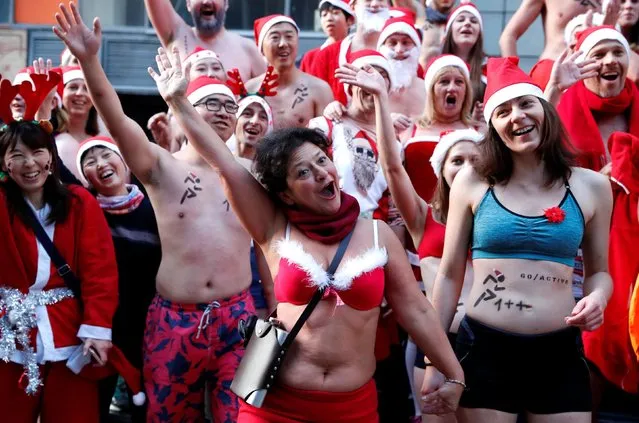 People take part in a half naked Santa run in downtown Budapest, Hungary, December 9, 2018. (Photo by Bernadett Szabo/Reuters)