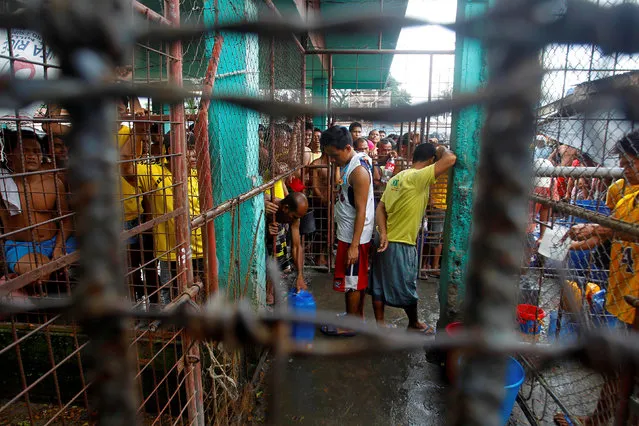 Inmates gather inside the prison following the escape of more than 150 inmates after gunmen stormed the prison in North Cotabato province, southern Philippines January 4, 2017. (Photo by Marconi Navales/Reuters)