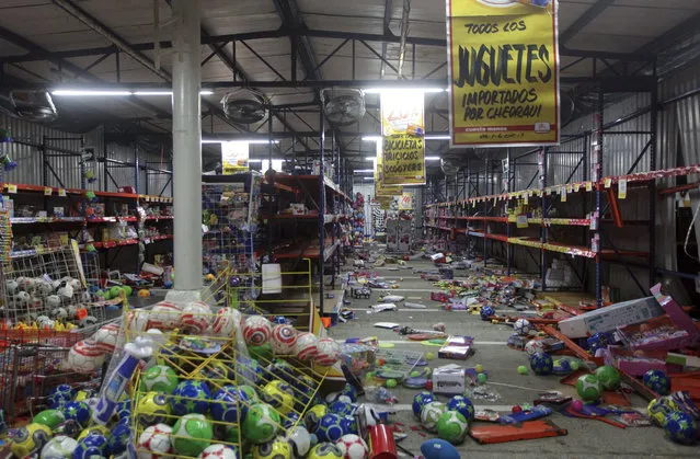 Toys land other products lie on the floor after a store was ransacked by a crowd in the port city of Veracruz, Mexico, Wednesday January 4, 2017. (Photo by Felix Marquez/AP Photo)