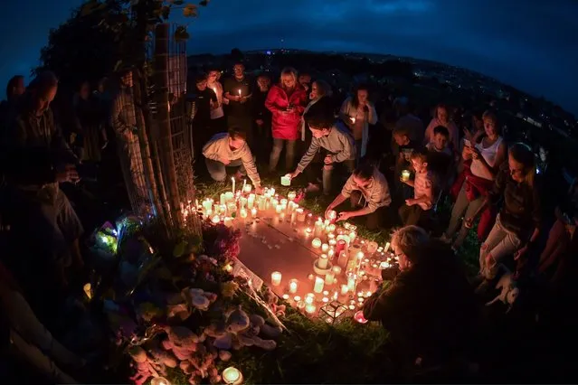 A candlelit vigil takes place at North Down Crescent Park on August 13, 2021 in Plymouth, England. Police were called to a serious firearms incident in the Keyham area of Plymouth on Thursday evening where lone gunman, named by police as Jake Davison, 22, shot and killed five people before turning the gun on himself. (Photo by Finnbarr Webster/Getty Images)