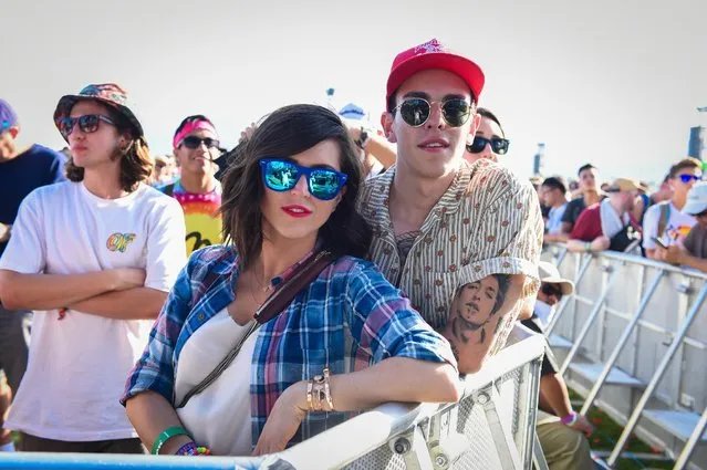Concertgoers poses for a photo at the 2015 Coachella Music and Arts Festival on Saturday, April 11, 2015, in Indio, Calif. (Photo by Scott Roth/Invision/AP Photo)