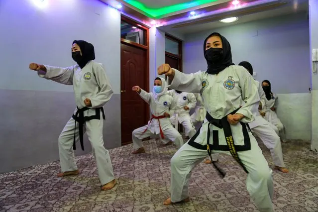 Afghan girls practice Takewondo at a home in Kabul, Afghanistan, 29 November 2023. Some of these girls were members of the national Taekwondo team who did not manage to escape from Afghanistan. Despite the closure of sports clubs to Afghan women, a number still train indoors. The Taliban banned women and girls from going to sports clubs and parks last year. (Photo by Samiullah Popal/EPA/EFE)