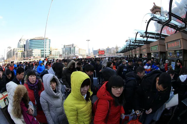 Crowd wait to enter a railway station in Beijing, China, January 23, 2016. (Photo by Reuters/Stringer)