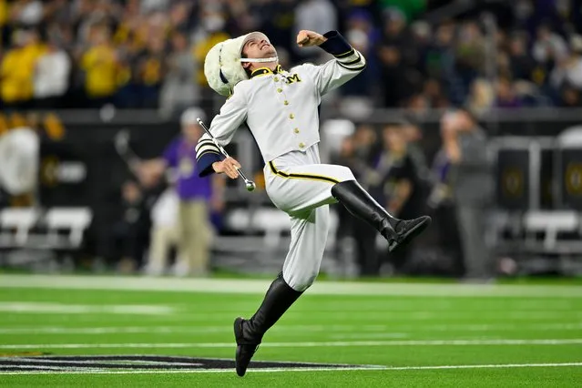 Michigan Wolverines drum major, Blake Brdak, marches before the 2024 CFP National Championship game against the Washington Huskies at NRG Stadium on January 08, 2024 in Houston, Texas. The Michigan Wolverines won 34-13. (Photo by Alika Jenner/Getty Images)